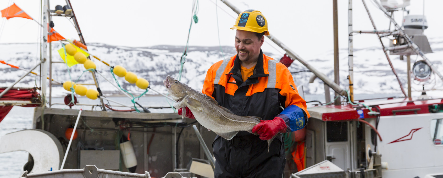 Arctic Supreme fisker holder en torsk