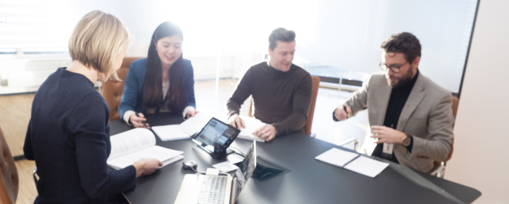 Employees together in a meeting room